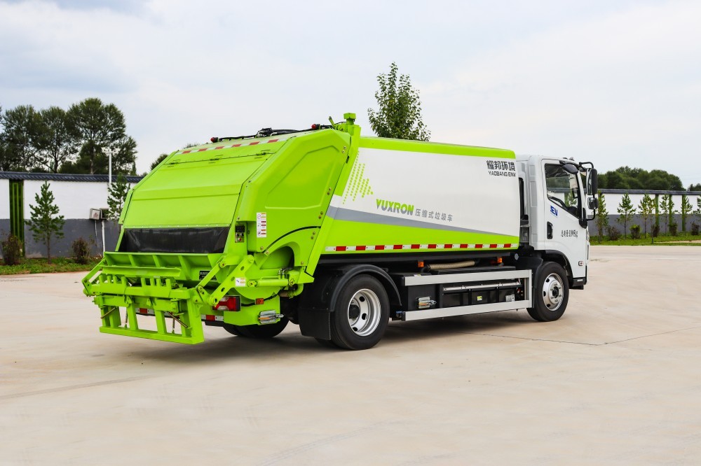 Garbage compression transfer vehicle