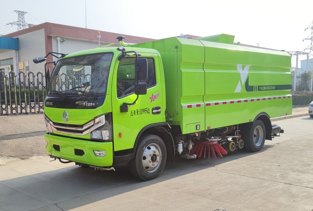 Road cleaning and sweeping vehicle