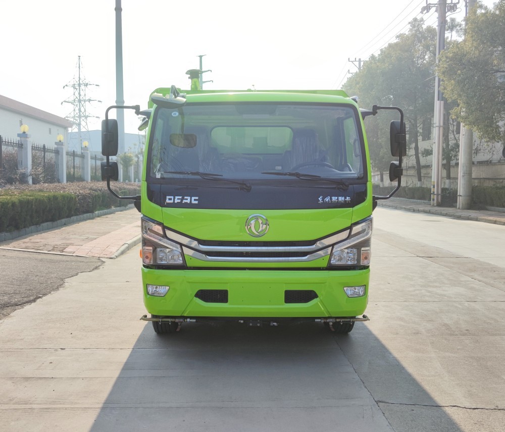 Road cleaning and sweeping vehicle