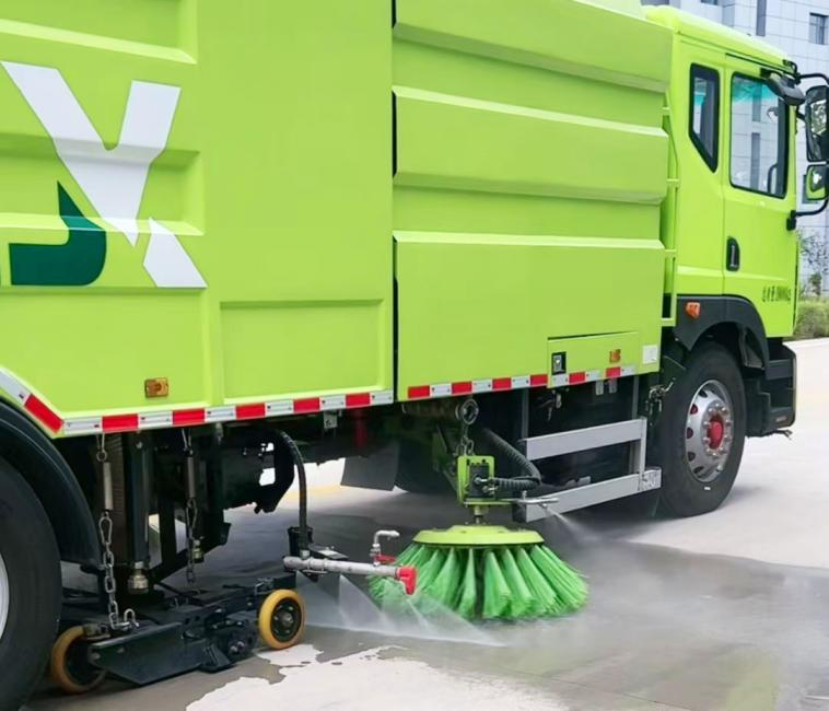 Road cleaning and sweeping vehicle